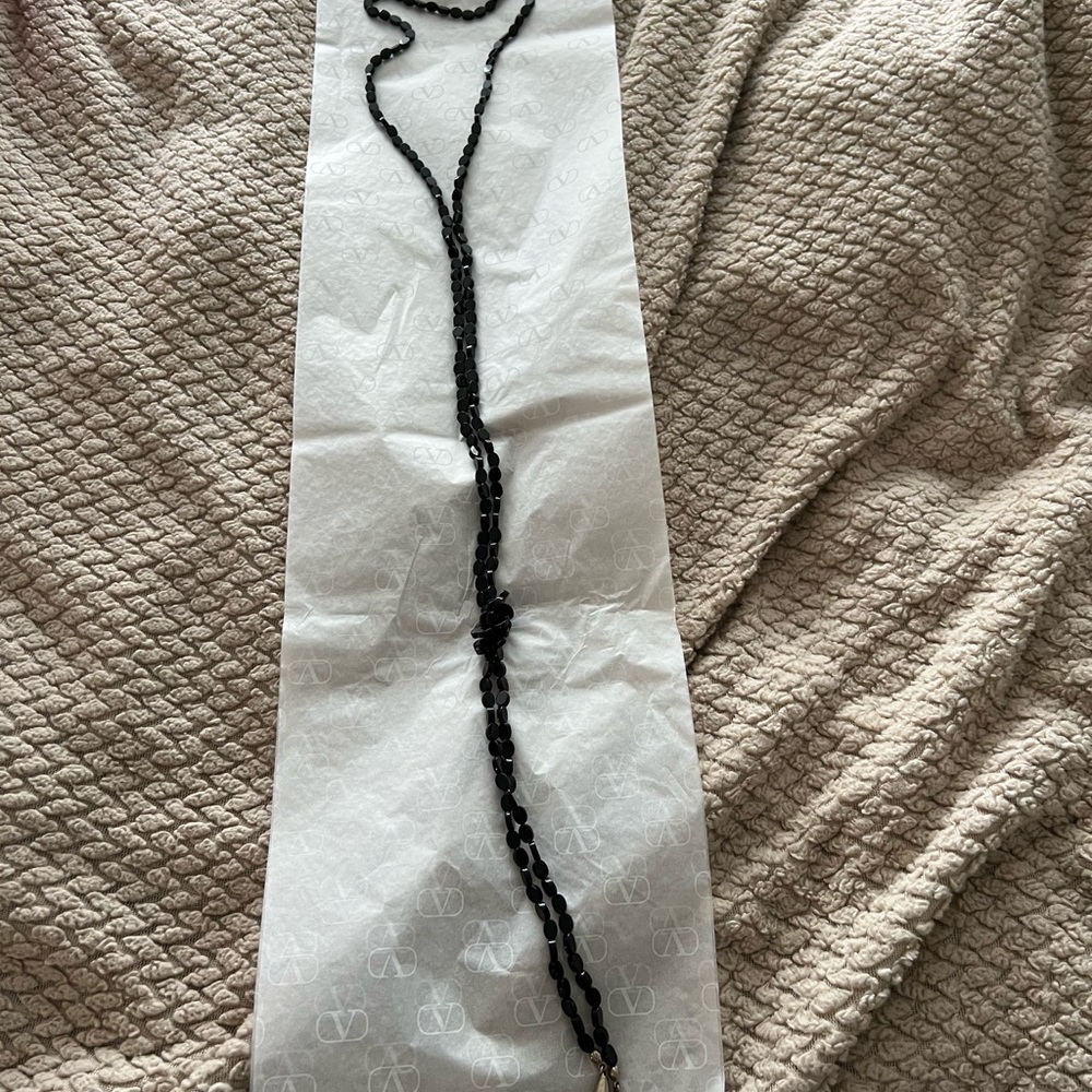 FUN Extra long black beaded necklace. With silver bead tips on the end.